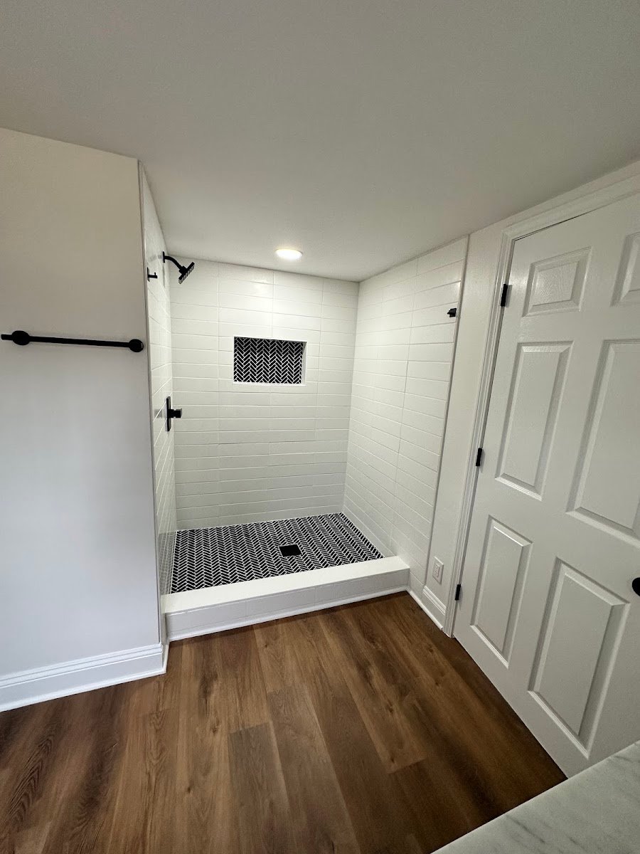 Bathroom shower remodel with white subway tile