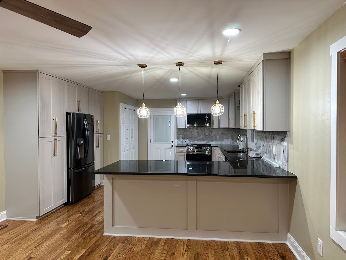 Kitchen remodel with white cabinets and hardwood floor