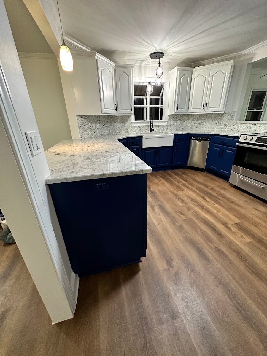 Kitchen remodel with navy blue cabinets